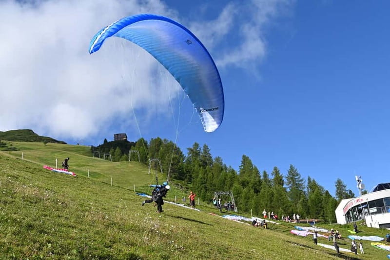 Innsbruck: Paragliding Adventure - Getting ready beside the parachutes