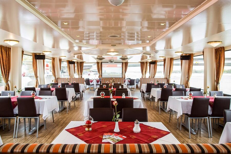 Vienna: Evening Cruise Along The Danube - The boats, seating, and onboard mood